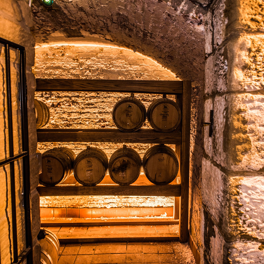 Small bourbon casks aging various beers in the GLBC Cellar Pub.